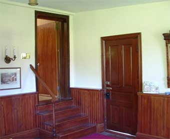 Interior after restoration. View to northwest, showing old cupboard which was retained.