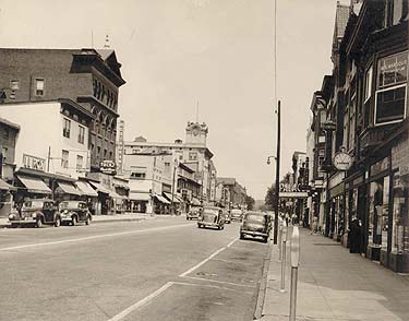 Main Street, looking east in a view taken ca. 1938. The 1901 Thompson Building stands out at the left, with the clock tower of the National Bank of Coatesville in the distance.