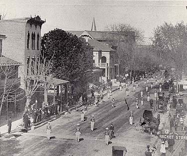 Parade on Main Street Parade on Main Street, 1889. In this view are visible the handsome Chester County Mutual Insurance Building, the Odd Fellow's Hall, and the tip of the steeple of the Episcopal Church of the Trinity.