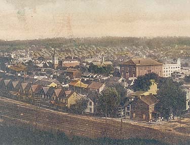 Coatesville Overview, 1910 Overview of the city, ca. 1910, looking southeast from the Pennsylvania Railroad tracks at North Second Avenue. The Opera House on Chestnut Street is prominent in this picture, along with the spire of the Methodist Church at Third Avenue. Thompson Building, National Bank of Coatesville Main Street, looking east in a view taken ca. 1938. The 1901 Thompson Building stands out at the left, with the clock tower of the National Bank of Coatesville in the distance. Third Avenue, Coatesville
