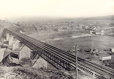 Pennsylvania Railroad Bridge over the west branch of the Brandywine. View looks eastward over the town. This steel bridge was replaced in 1904 with a new stone arch bridge, accommodating four main line tracks.