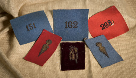 French Military Uniform Insignia — Stewart brought these home as souvenirs of his time serving with the French Army. — National Iron & Steel Heritage Museum